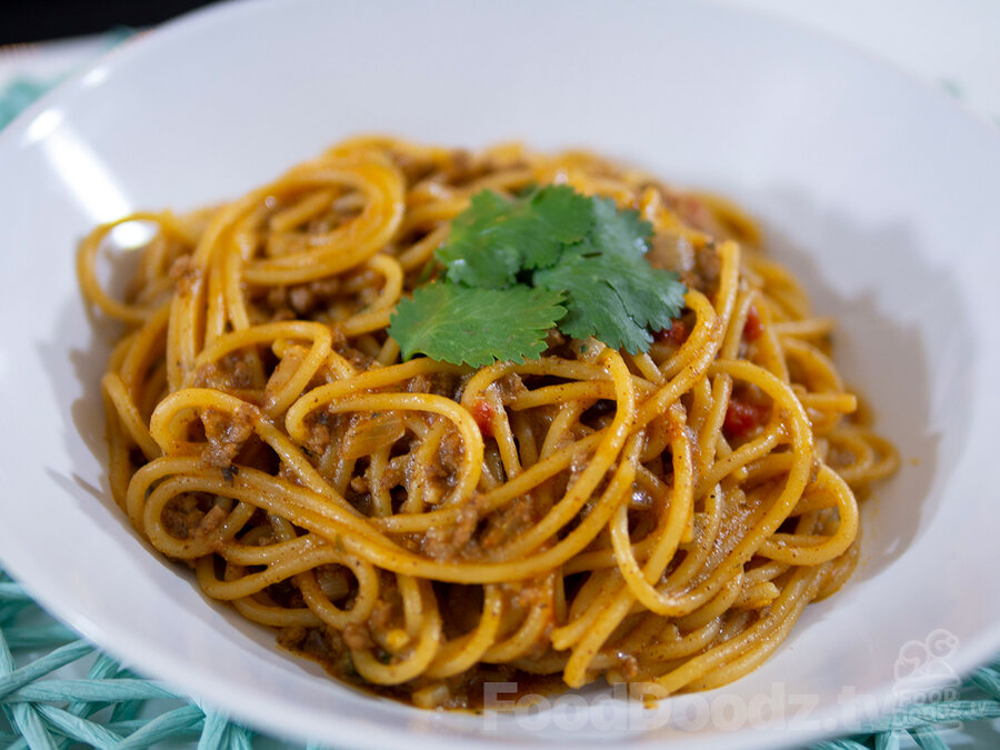 Tasty bowl of Tex-Mex Taco Spaghetti topped with cilantro leaves