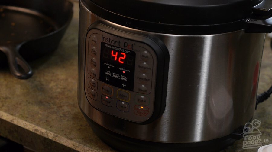 Instant Pot with lid on and turned on with timer set to 42 minutes