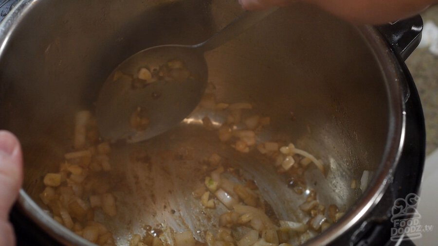Adding garlic. Scraping all brown bits off bottom of pot while sauteing onions.