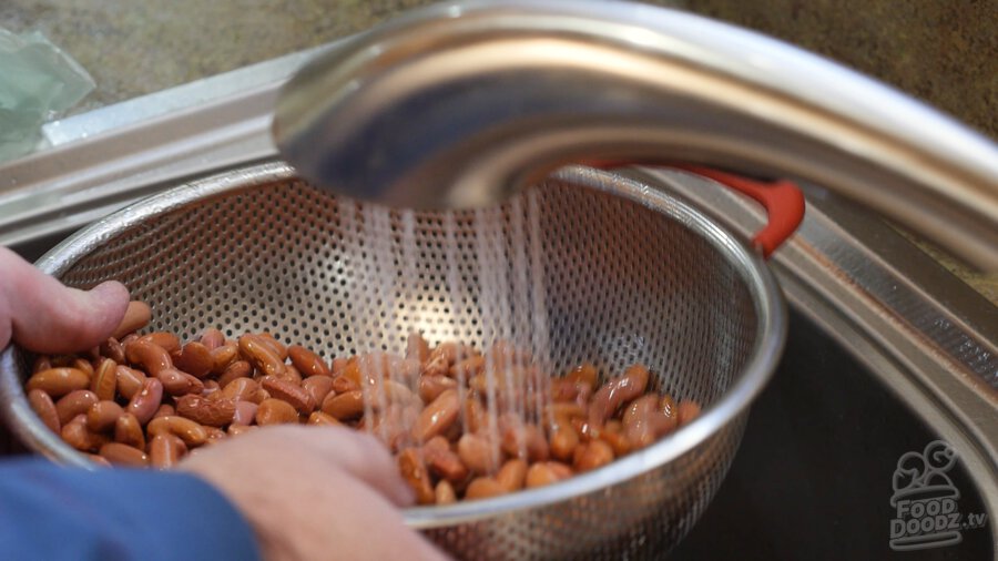 Rinsing soaked beans