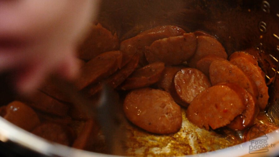 Browning andouille in pot
