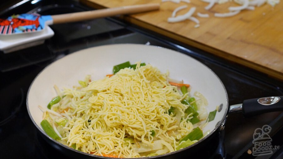 Adding the noodles to the pan