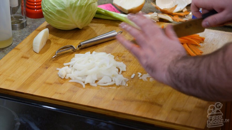 Thinly slicing onion