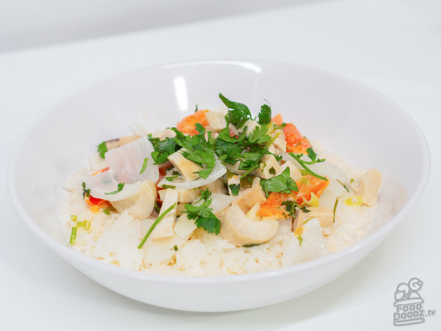 A big bowl of delicious Spicy Thai Coconut Chicken Soup (Tom Kha Gai).