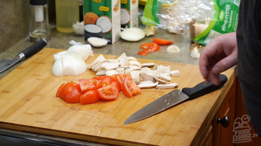 Cutting tomatoes into wedges