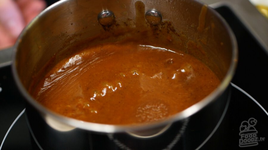 The enchilada sauce after simmering for about 10 minutes
