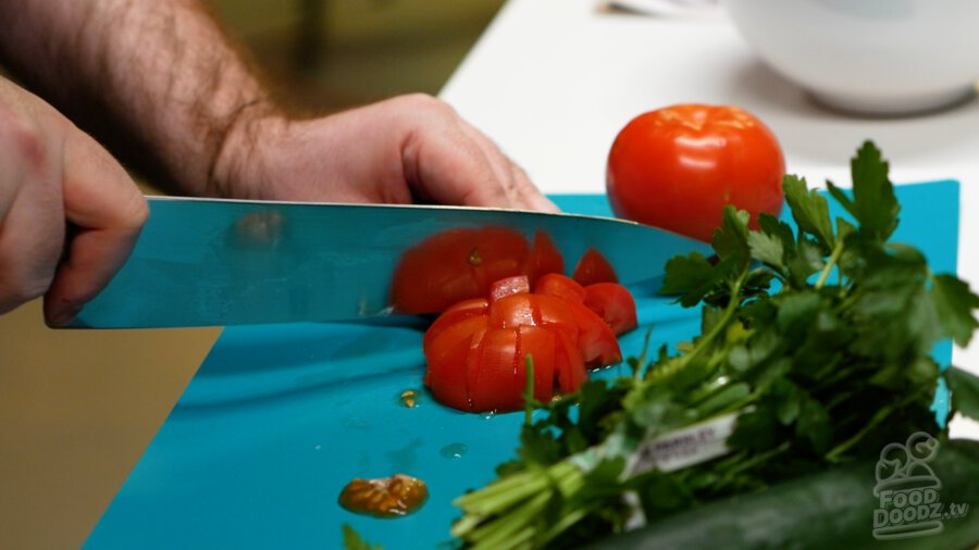 Chopping up tomato