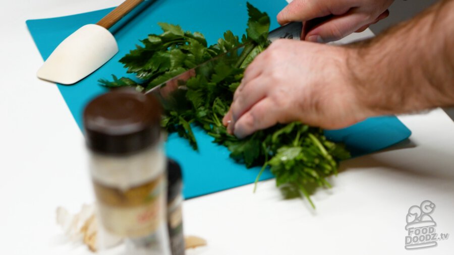Chopping off leaves from stems of leaves of herbs