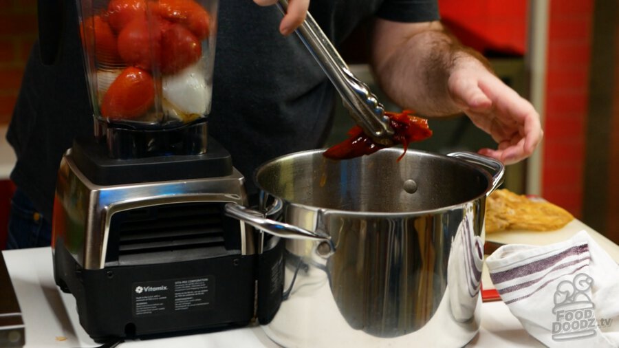 Adding boiled chile to blender
