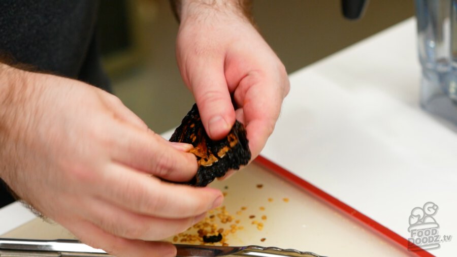 Removing the seeds from a ancho chile
