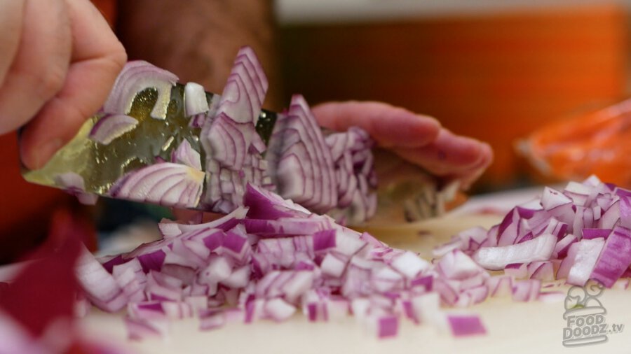 Finely chopping the onion
