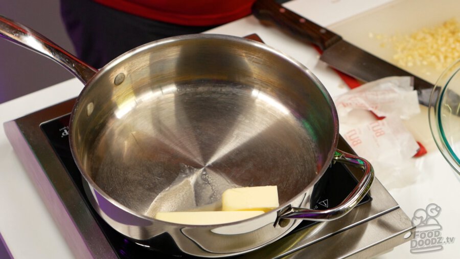 Adding butter to pan