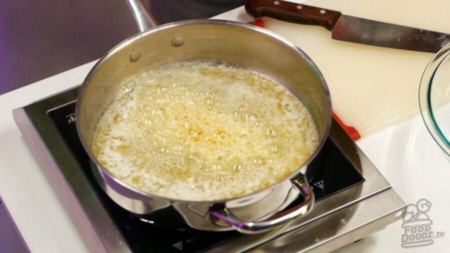 Minced garlic sauting in butter