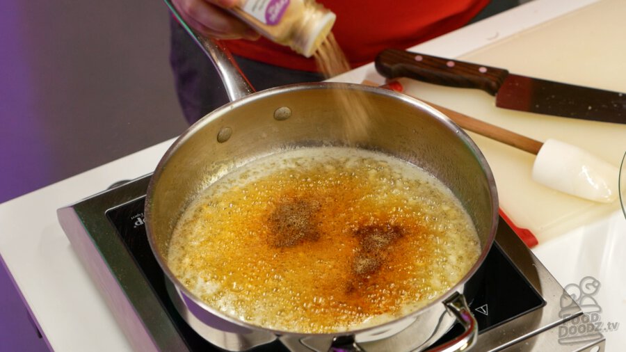 Adding garlic powder to pan