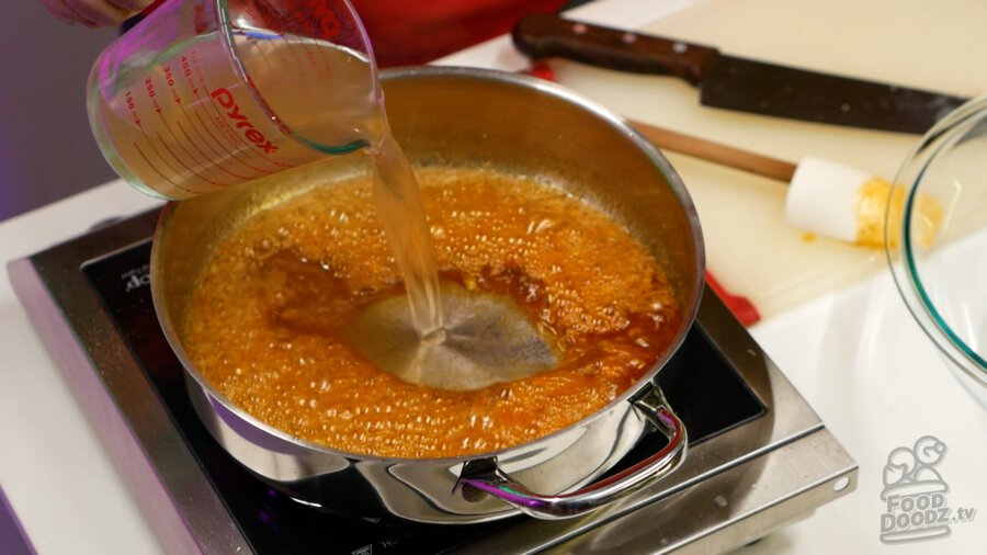 Adding boiling liquid to pan