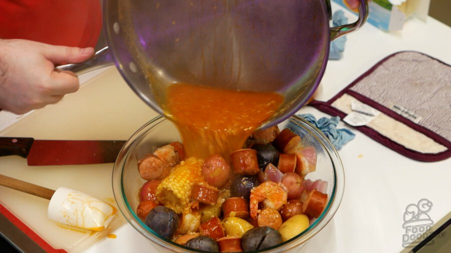 Pouring sauce over boil ingredients
