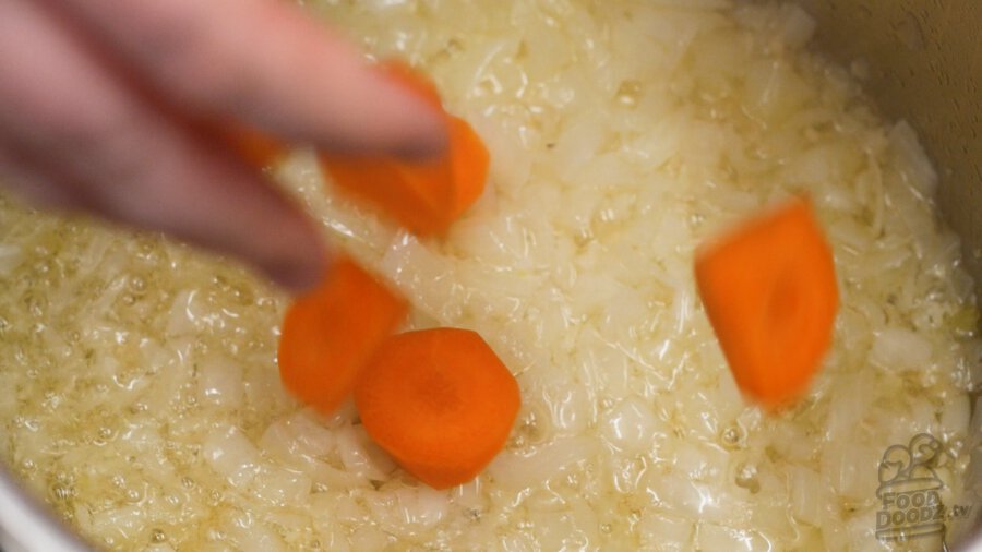 Adding carrots to pot
