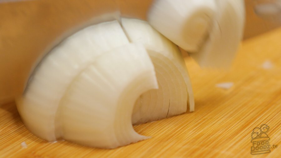 Slicing onion into large slices