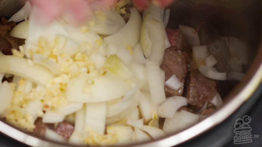 adding garlic to pressure cooker