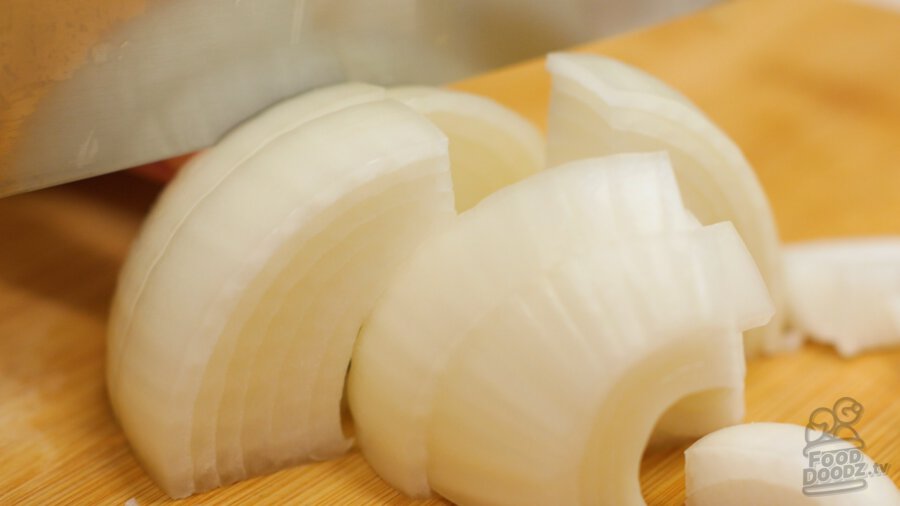 Slicing onion into large slices