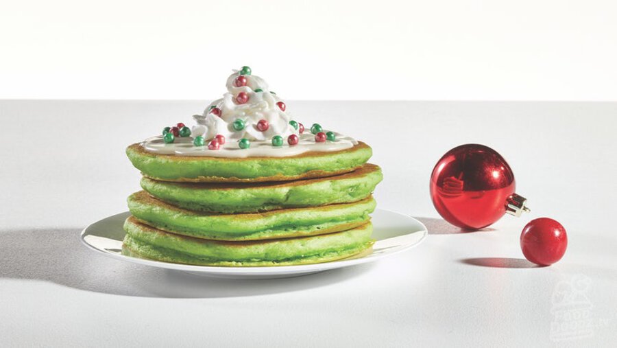 IHOP jolly cakes Green pancakes covered in sweet cream cheese white icing, whipped topping, and ornament sprinkles