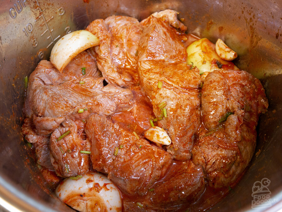 Browned pork shoulder chunks added back to the pan sauce mixture
