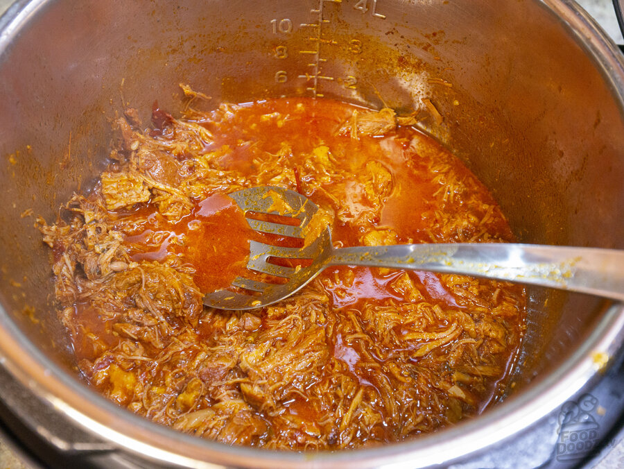 Carnitas after they have been simmered and shredded with a spoon