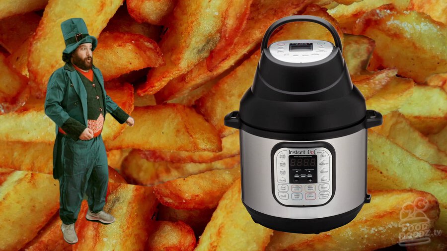 Adam dressed as leprechaun trying to blow on an Instant Pot with giant french fries behind him