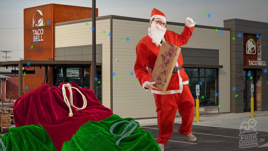 Austin dressed as Santa dancing in front of Taco Bell with a bell box